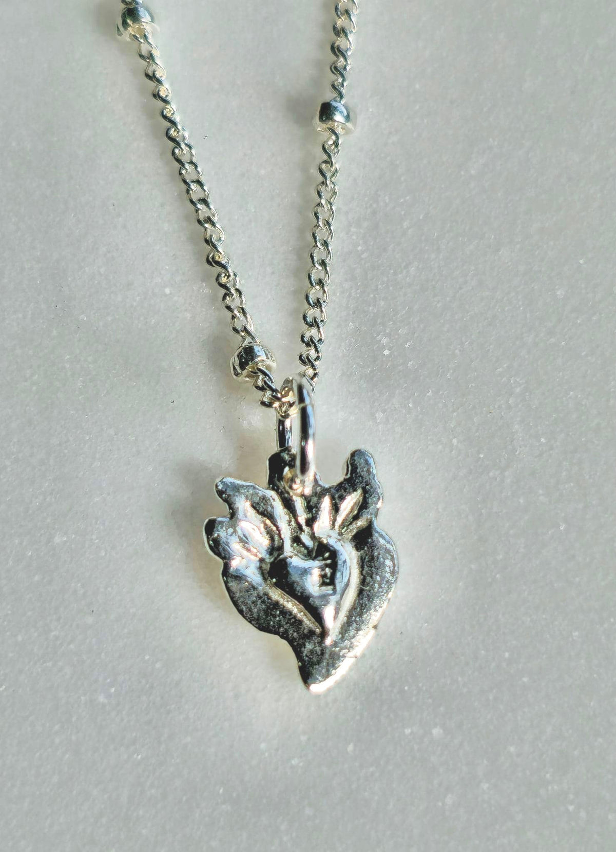 Tiny Sacred Heart Necklace in Sterling Silver