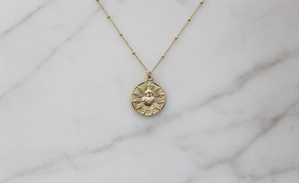 The Little Sacred Heart® minimalist version in 14k Gold