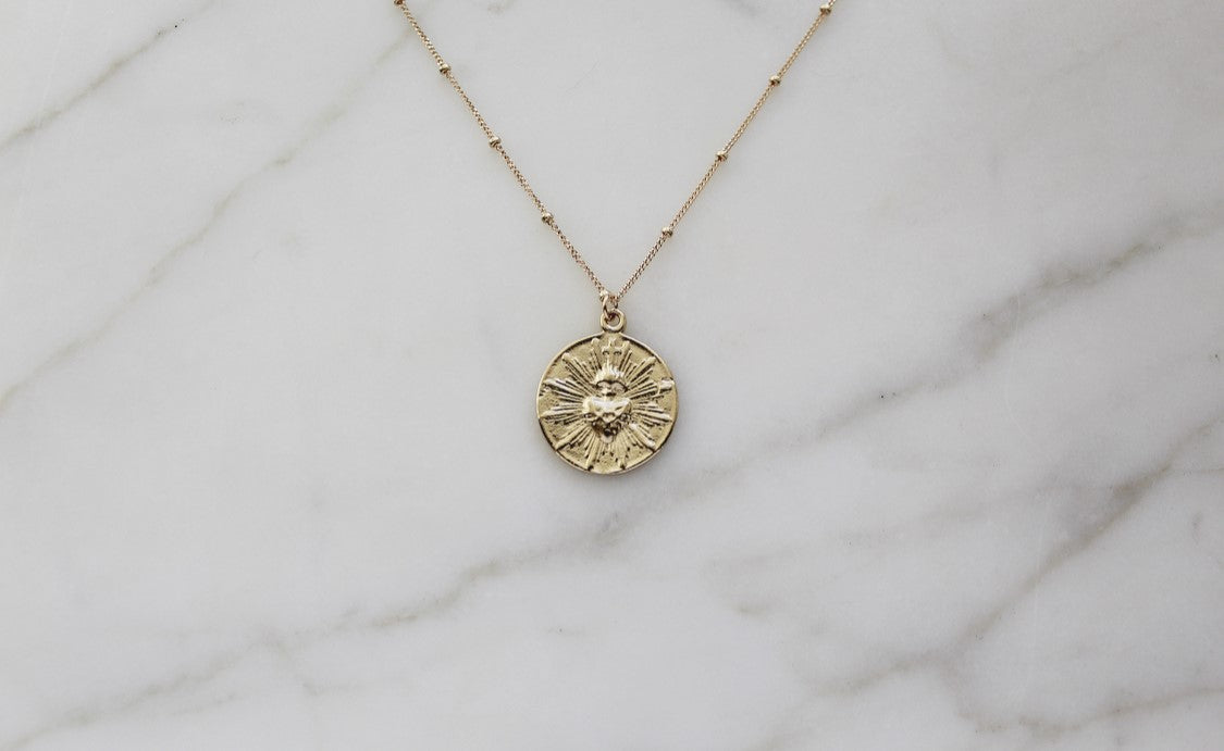 The Little Sacred Heart® minimalist version in 14k Gold
