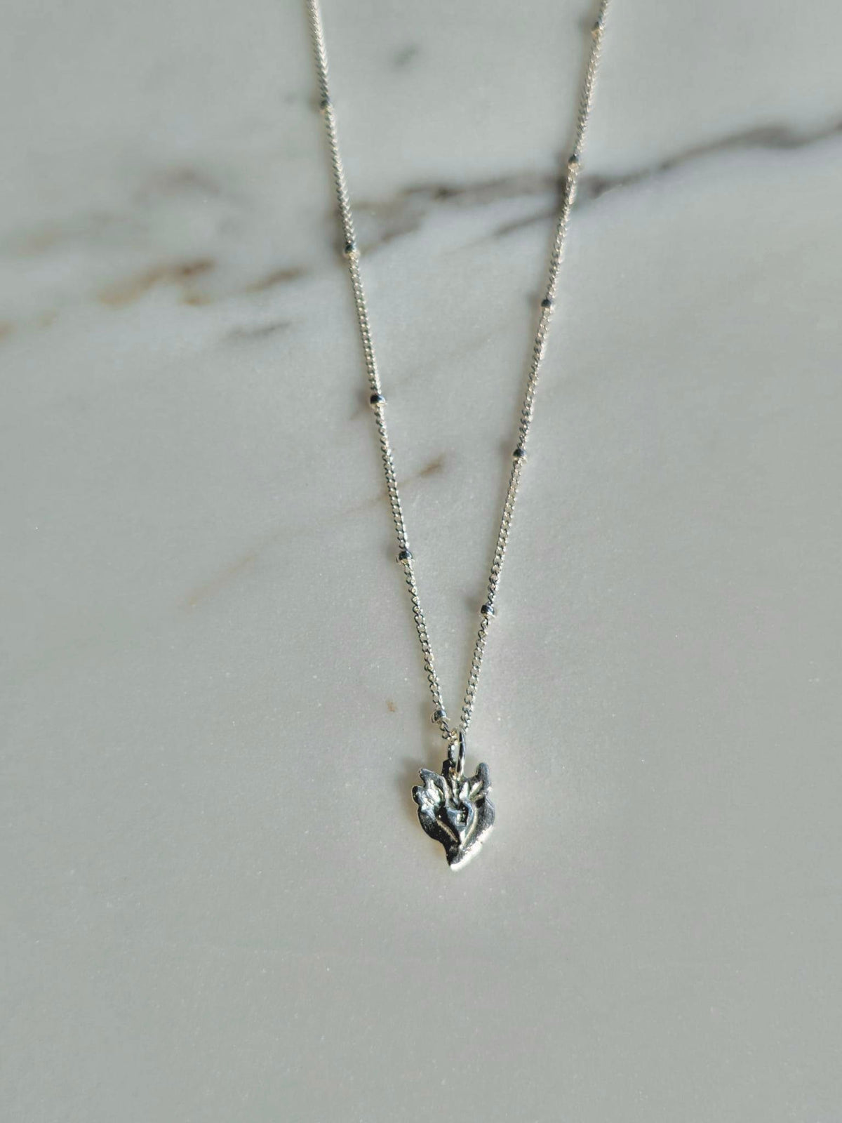 Tiny Sacred Heart Necklace in Sterling Silver