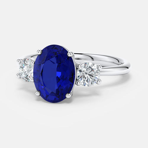 2.50 CTW oval lab-grown blue sapphire and diamond three-stone engagement ring set in 14K white gold with prong setting